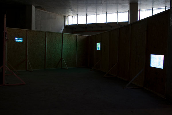 Aoife Desmond and Seoidín O'Sullivan: Trespass Hoarding Films (Hoarding Walk, Crawl, Stalker reenactment and Fire), 2007 - 2010, four-channel video and sculptural installation; courtesy the artists / Tulca