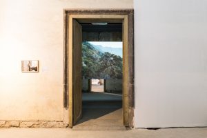 URIEL ORLOW, Wishing Trees, 2018, Video installation, documents and artefacts in vitrines, photography. Dimensions variable. Photo: Simone Sapienza, courtesy of Manifesta 12 Palermo and the artist.